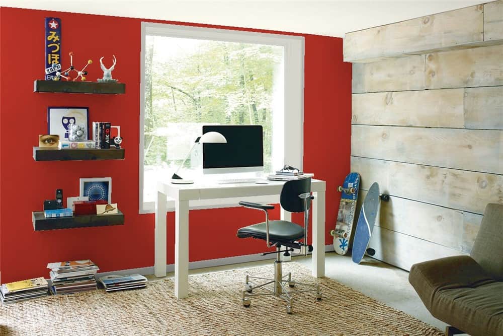 Home office with red accent wall featuring Benjamin Moore shade Million Dollar Red 2003-10