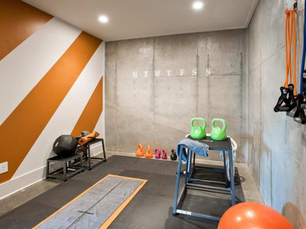 basement gym with artificial lighting